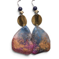 Loergann Studio artisan statement drop earrings with abstract blue, pink, and gold pebble pendants and hammered brass.