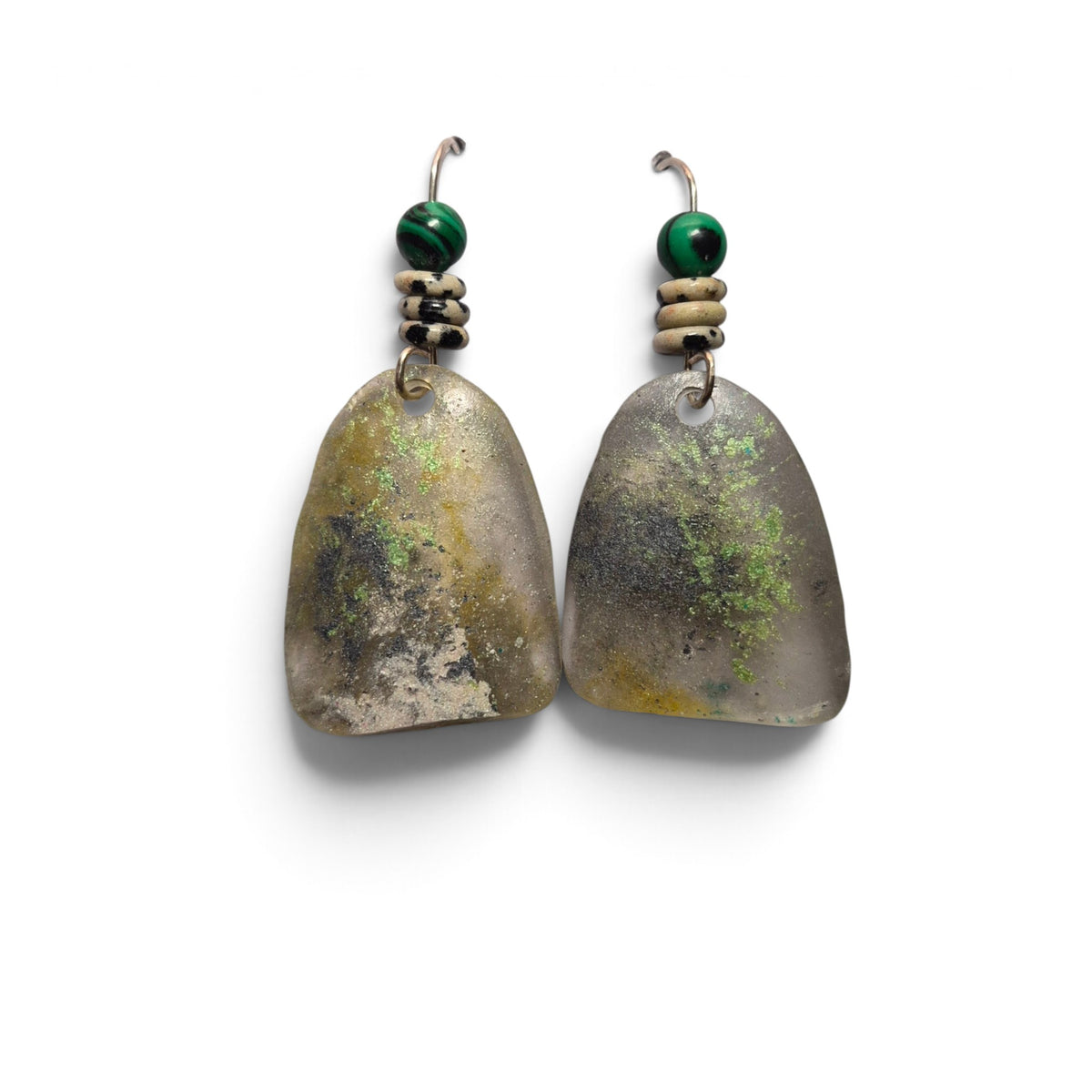 Loergann Studio artisan drop earrings with textured translucent stone pendants, green malachite beads, and metal hooks.