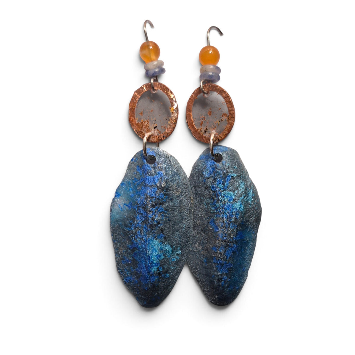 Loergann Studio artisan drop earrings with midnight blue leaf pendants, copper rings, and amber and grey bead accents.