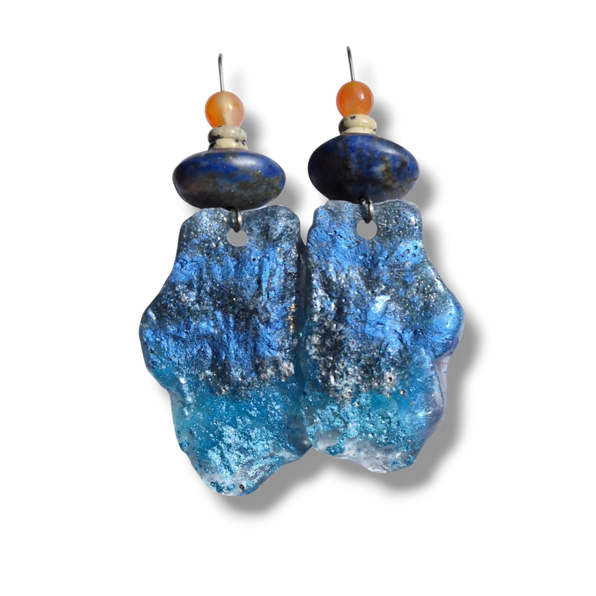 Loergann Studio artisan statement drop earrings with blue textured resin, lapis lazuli, and carnelian beads.