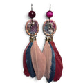 Loergann Studio artisan feather drop earrings with magenta beads, metallic patina charms, and multi-tonal feathers.