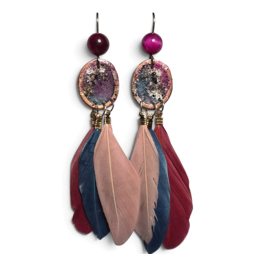 Loergann Studio artisan feather drop earrings with magenta beads, metallic patina charms, and multi-tonal feathers.
