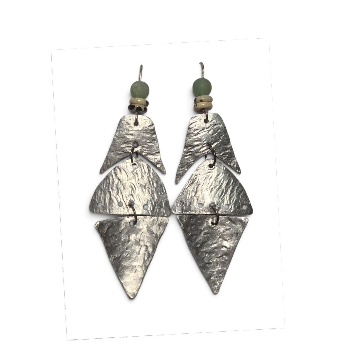 Loergann Studio handcrafted silver-tone metal geometric drop earrings with sage green and patterned bead accents.