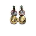 Loergann Studio artisan layered drop earrings with gold-tone discs, oxidised copper, and sage green bead accents.